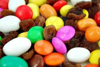 Candies with raisin background close detail