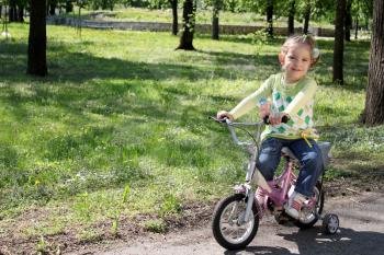 child riding bicycle