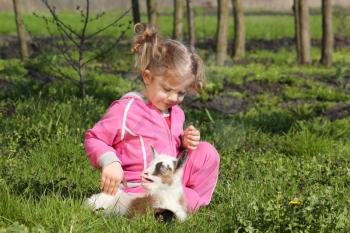 child and little goat pet