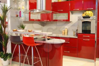 Home interior with new modern red kitchen