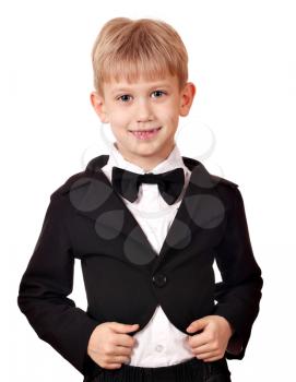 boy with tuxedo and bow tie posing