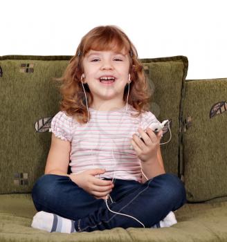 happy little girl listening music