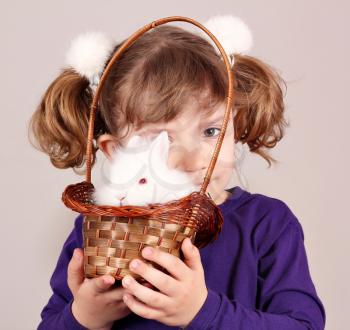little girl with white rabbit pet