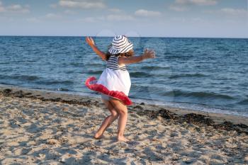 little girl running on beach