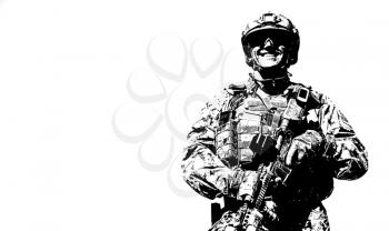 Half length low angle location shot of special forces soldier in field uniforms with weapons, monochrome