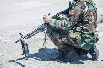 NATO soldier with machine gun during the military operation