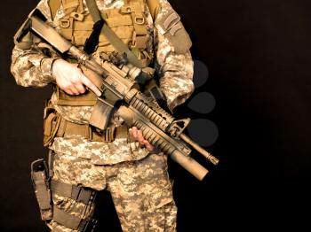US soldier holding his assault rifle