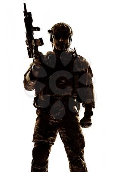 Silhouette of special warfare operator with assault rifle