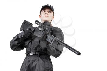 Female police officer SWAT in black uniform with sniper rifle studio shot
