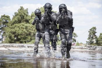 Spec ops police officers SWAT in action in the water