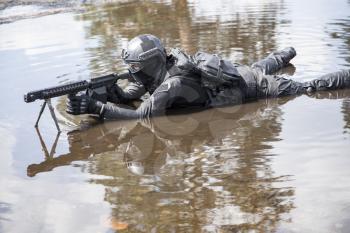 Spec ops police officer SWAT in action in the water