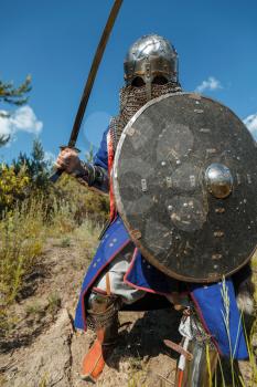 Mongol horde warrior in armour holding traditional saber