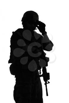 United states Marine Corps special operations command Marsoc raider with weapon. Silhouette of of Marine Special Operator white background