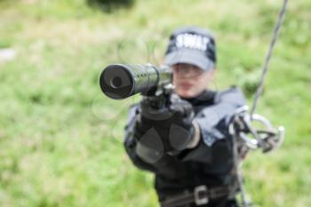 Female police officer SWAT during assault operation