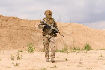 Equipped and armed special forces soldier during military operation