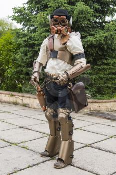 Lviv, Ukraine - May 23.2015:Cosplayer  girls posing in a steampunk suit and a respirator mask , Photo taken at cosplayers meeting indoor concert hall in Lviv city.May 23.2015