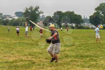 Lviv, Ukraine - July 23, 2017: Unknown aircraft modelers  launches his own radio-controlled  model  glider  in the countryside near the city of Lviv., Ukraine.