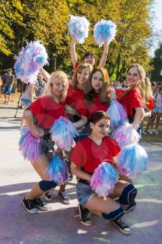 Lviv, Ukraine - August 30, 2015: Cheerleaders have fun during the festival of color in a city park in Lviv.