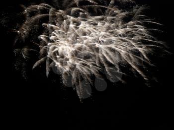 Yellow holiday fireworks on the black sky background.