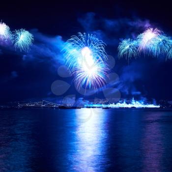 Blue colorful fireworks on the black sky background