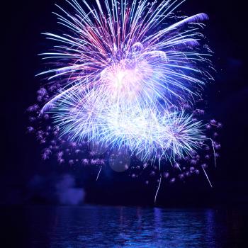 Blue colorful fireworks on the black sky background