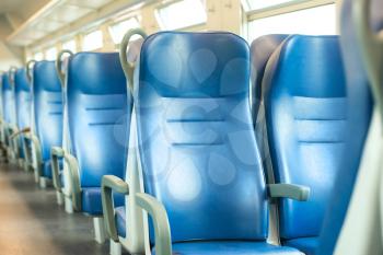 Empty blue seats in european modern train