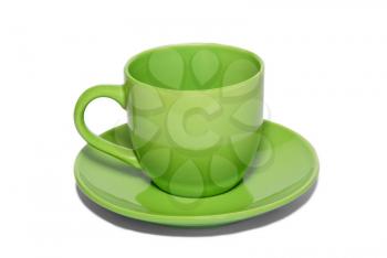 Green ceramic cup and saucer isolated on white.