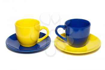 Two colored teacups isolated on white.