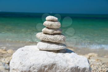 Stone tower with blue sky and sea background