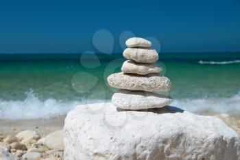 Stone tower with blue sky and sea background