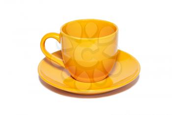 Orange ceramic cup and saucer isolated on white.