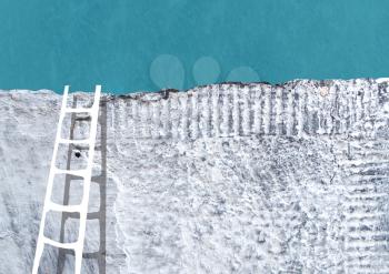 Ladder near gray concrete wall. Grunge abstract background. Suitable for various designs.