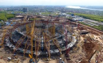 Moscow, Russia - May 12, 2018: Equipment for the construction of the stadium. Tower cranes and construction machinery. Construction of the stadium.