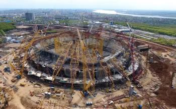 Moscow, Russia - May 12, 2018: Equipment for the construction of the stadium. Tower cranes and construction machinery. Construction of the stadium.