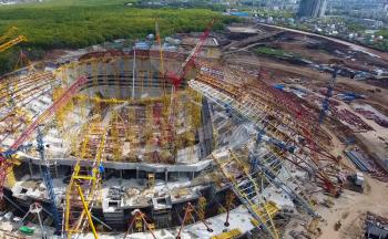 Moscow, Russia - May 12, 2018: Equipment for the construction of the stadium. Tower cranes and construction machinery. Construction of the stadium.