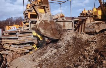 Bulldozer bucket. A bulldozer digs a hole.