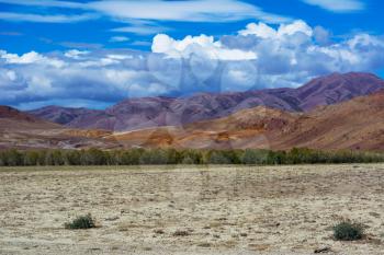 Mountain View steppe landscape, blue sky with clouds. Chuya Steppe Kuray steppe in the Siberian Altai Mountains, Russia