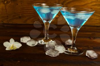 Blue curacao liqueur in a martini glasses. Blue cocktail. Blue margarita. Blue Hawaiian cocktail. Blue curacao liqueur.  Blue Martini
