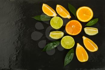 Healthy eating concept citrus on the black background. Fresh food. Ripe fruit. Citrus fruit. Vegetarian food. Fresh fruit. Mixed fruit. Fruit background. Healthy eating concept