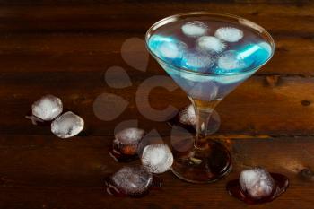 Iced blue margarita cocktail. Blue margarita. Blue cosmopolitan. Blue Lagoon. Blue cocktail. Blue Martini. Blue Hawaiian cocktail. Blue curacao liqueur.