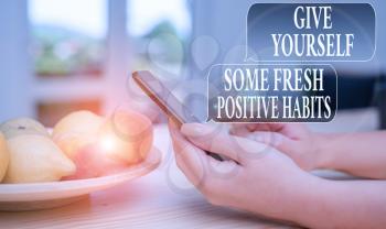 Text sign showing Give Yourself Some Fresh Positive Habits. Business photo text Get healthy positive routines woman using smartphone office supplies technological devices inside home