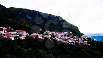 City in the mountain view. Greek houses in natural environment. Beautiful landscape. Corfu Greece typical town. Picturesque. Scenic. Pretty place to visit