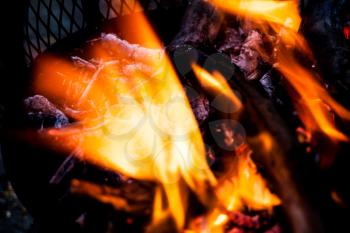 Blurred fire flames in abstract image. Extreme closeup of open fire flames. Barbecue fire preparing in the outdoors.  Burning wood in extreme closeup view