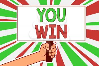 Text sign showing You Win. Conceptual photo be first in school race or competition Got gold medal Rating Man hand holding poster important protest message green red rays background