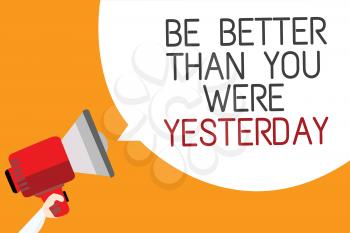 Text sign showing Be Better Than You Were Yesterday. Conceptual photo try to improve yourself everyday Man holding megaphone loudspeaker speech bubble message orange background