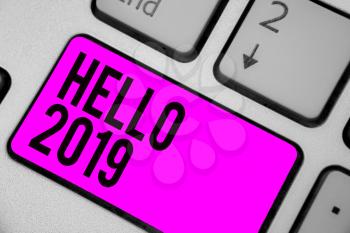 Text sign showing Hello 2019. Conceptual photo Hoping for a greatness to happen for the coming new year Keyboard purple key Intention create computer computing reflection document