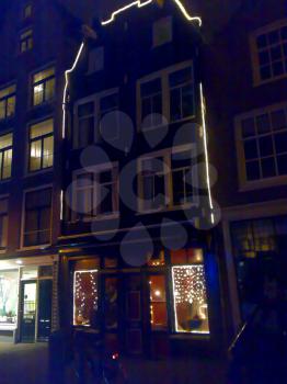 AMSTERDAM, NETHERLANDS - DECEMBER 25, 2007: Architecture and people on the streets city