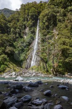Scenic view of Thunder Creek Falls in New Zealand