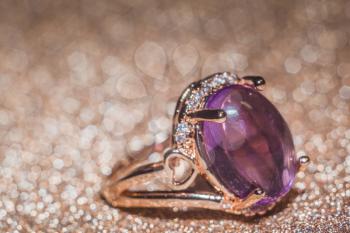 Fashion rose gold ring made of natural purple amethyst gemstone.