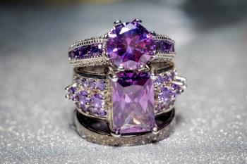 Fashion silver ring with purple zirconia, amethyst imitation.